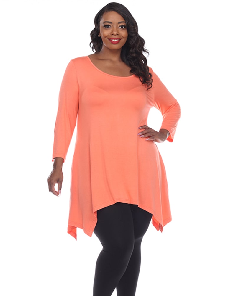Front of a model wearing a size 1X Makayla Tunic Top in Coral Pink by White Mark. | dia_product_style_image_id:246418